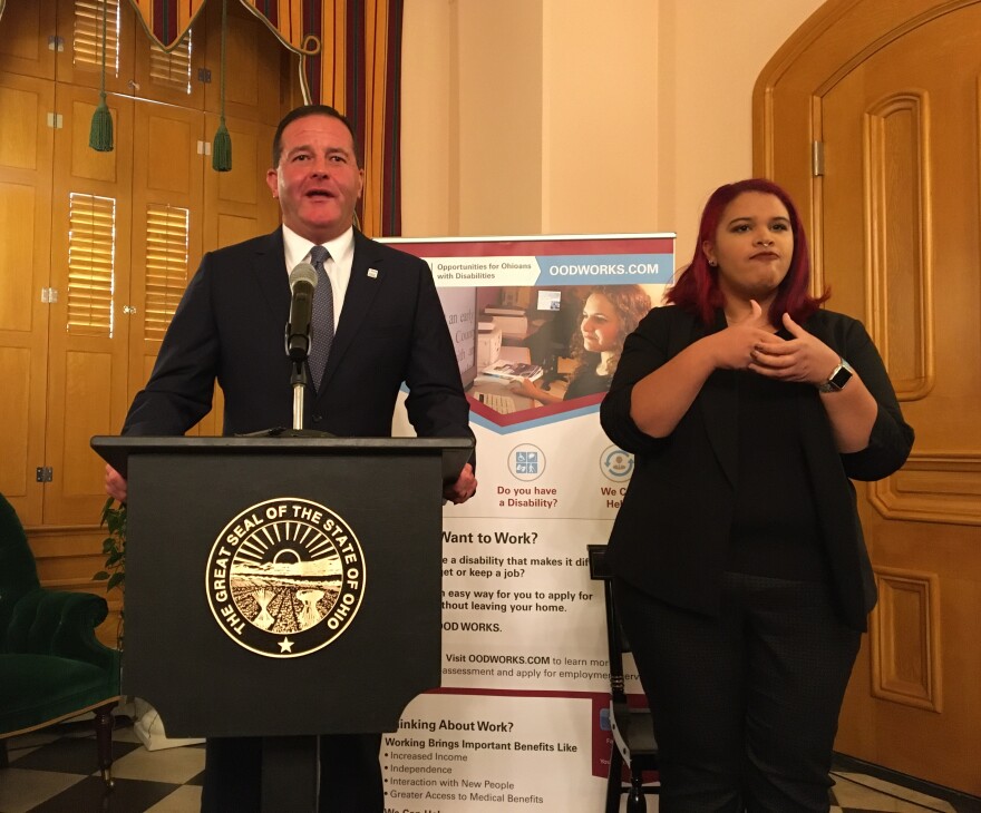 Opportunities for Ohioans with Disabilities director Kevin Miller announces the College2Careers program, with the assistance of a sign language interpreter.