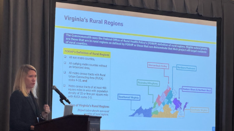 Heidi Hertz, Director of Virginia’s Rural Health Transformation Fund, shows current federally designated "rural" area maps at the Claude Moore Scholars & Regional Healthcare Workforce Meeting Friday morning.