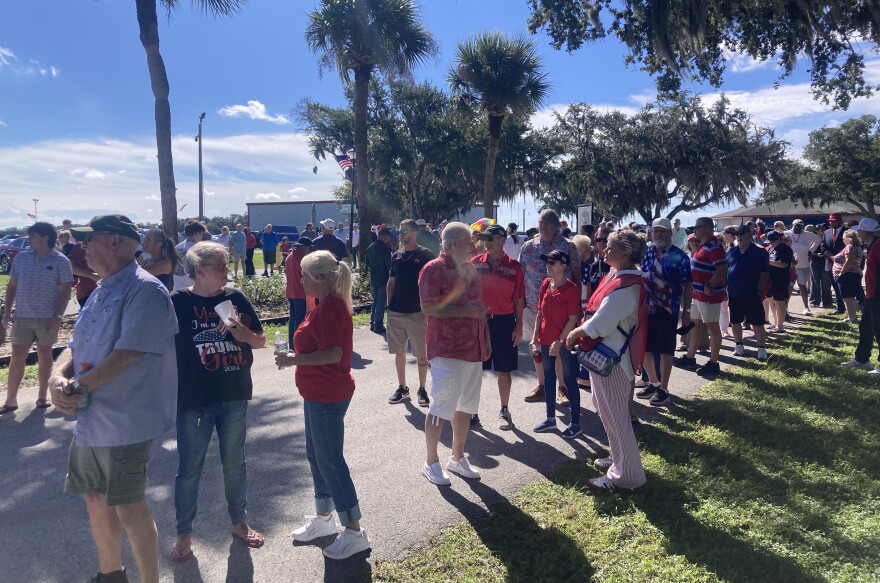 People lining up outside to get into the rally