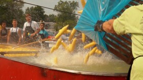 Hungry onlookers await their buttery sweet corn at Mendota's Sweet Corn Festival. This year's annual celebration is August 8-11 in Mendota, Il.