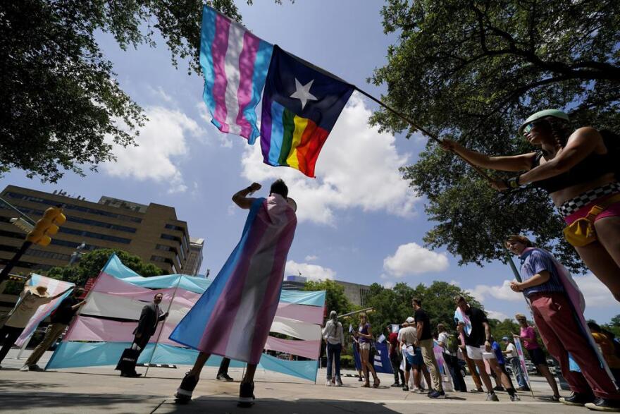 Demonstrators gather on the steps to the State Capitol to speak against transgender-related legislation bills being considered in the Texas Senate and House, May 20, 2021, in Austin, Texas. A federal ruling on Aug. 16, 2022, that gender dysphoria is covered by the Americans with Disabilities Act, could help block conservative political efforts to restrict access to gender-affirming care, advocates and experts say.