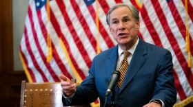 Gov. Greg Abbott signs Senate Bill 2 and Senate Bill 3 at the Texas Capitol. The omnibus bills will change the state’s power grid and the people who oversee it.