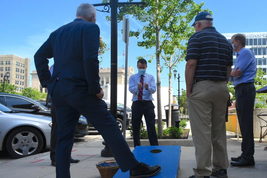 U.S. Sen. Todd Young (R-Ind.) talks to business owners in South Bend before a press conference to promote the RESTART Act bill he co-authored.