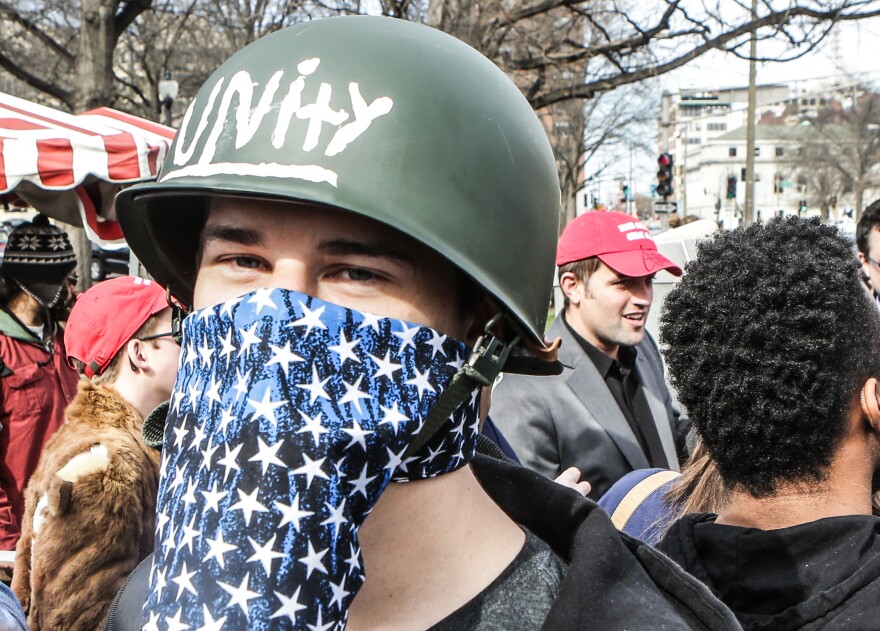 Supporters and protestors of Donald Trump gathered across the street of the Peabody Opera House where he spoke Friday afternoon in St. Louis