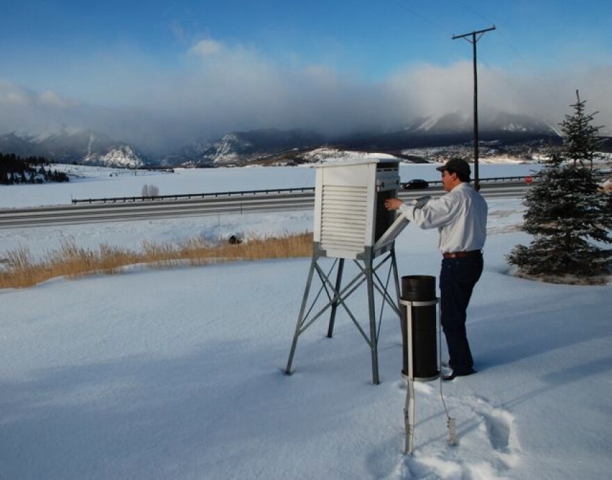 Denver Water engineer Dave Fernandez takes a daily weather reading, tracking new snowfall, temperature and moisture near Dillon Reservoir, a key drinking water source for millions of people around Denver who rely on a steady melt of mountain snow.