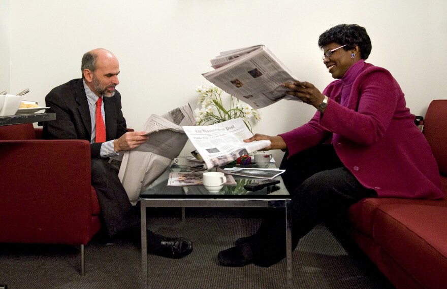 Gerald Seib (left) and Gwen Ifill go over the news before filming ABC's <em>This Week</em> at the Newseum in Washington, D.C., in December 2008.