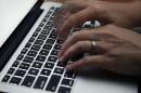 A person working on a laptop in North Andover, Massachusetts. (Elise Amendola/AP)