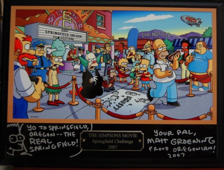 Plaque featuring Simpsons characters