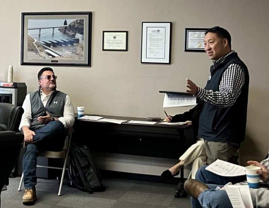 Friant Water Authority Chief Operating Officer Johnny Amaral, left, listens to Tulare Irrigation District General Manager Aaron Fukuda at the Kaweah Delta Water Conservation District meeting Tuesday.