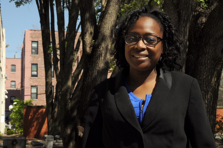 Ronicia Otey, 25, stands outside the Sickle Cell Association in St. Louis. Otey said she abused opioids briefly after a traumatic event, because they were available. After treatment and returning to school, she takes the lowest dose she can handle during 