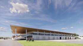 Rendering of brown facility with people standing nearby 