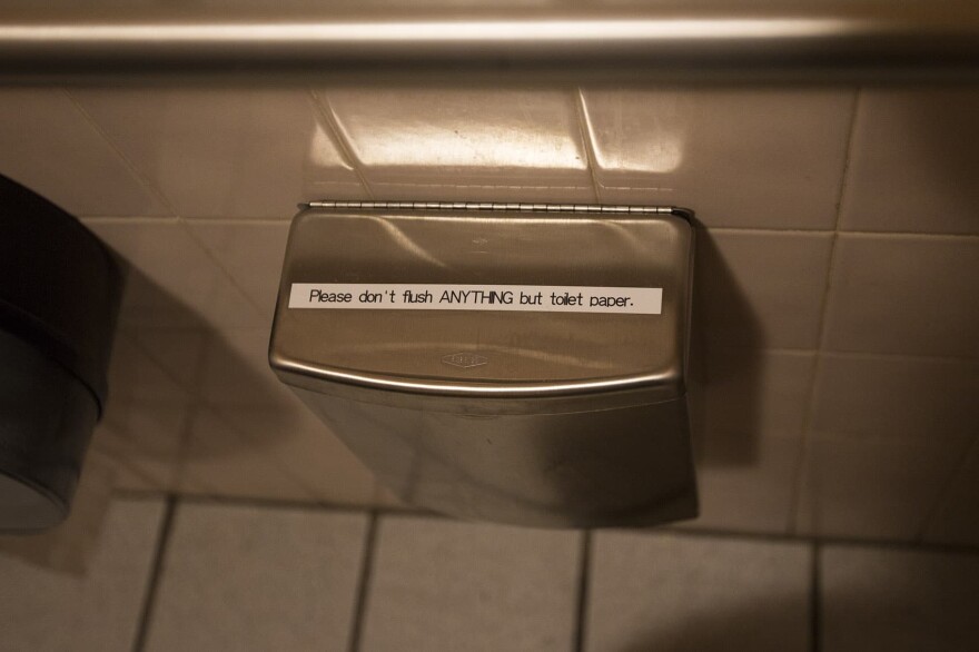 A trash receptacle for non-flushable items in the bathroom of the 1369 Coffee House. (Jesse Costa/WBUR)