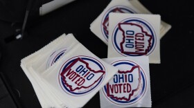 "Ohio Voted" stickers are seen.