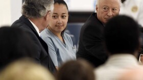 Cyntoia Brown, a woman serving a life sentence for killing a man when she was a 16-year-old prostitute, talks with her attorney, Charles Bone, during her clemency hearing Wednesday, May 23, 2018, at Tennessee Prison for Women in Nashville, Tenn. (Lacy Atkins /The Tennessean via AP, Pool)