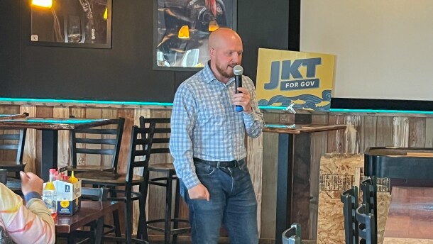 Gubernatorial candidate Jonathan Kreiss-Tomkins speaks with residents during his meet-and-greet at the Norwegian Rat Saloon on July 18.