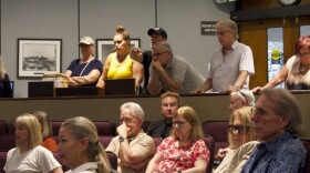 Nicholas DiIelsi, owner of Cafe Amici, yells from the gallery at Sarasota parking staff during Monday's parking open house.