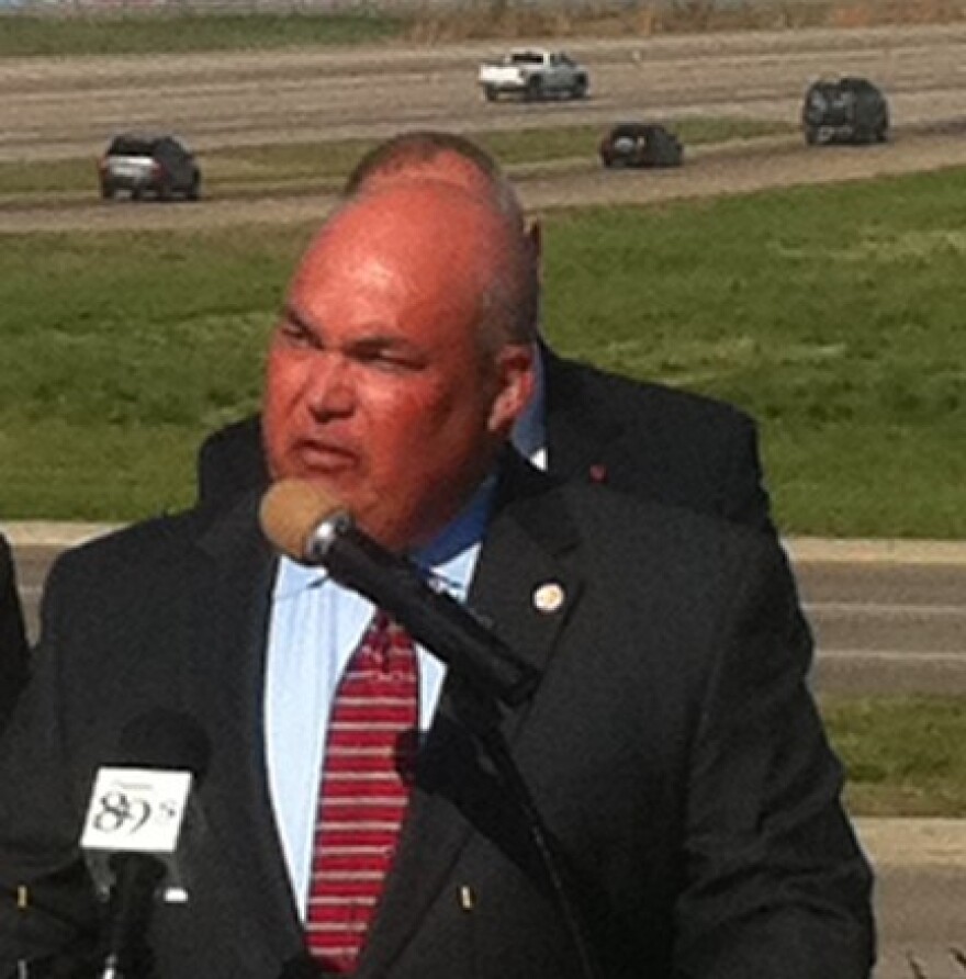 With the BA Expressway as a backdrop, Broken Arrow Chamber of Commerce President Wes Smithwick announces the agreement.