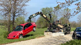 A TRX prototype machine operated remotely moves a car out of the way at a Fort Leonard Wood range. The armed forces are considering working with the new technology to improve efficiency and get soldiers out of harm's way.