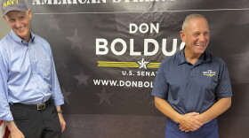 Sen. Rick Scott, R-Fla., chairman of the National Republican Senatorial Committee, campaigns alongside New Hampshire Republican Senate candidate Don Bolduc in Atkinson, N.H. on Sunday, Oct. 30, 2022. (AP Photo/Steve Peoples)