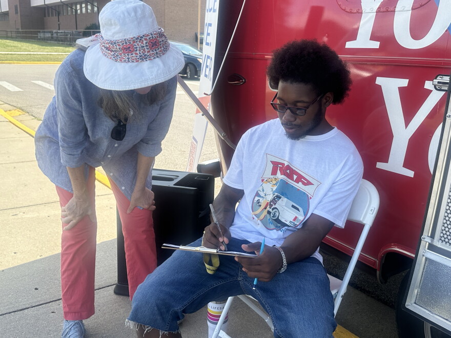 A League of Women's Voter volunteer helps a Central State student register to vote in the November 2025. 