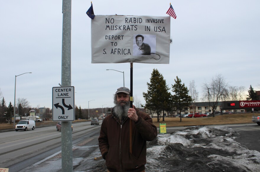 Gary Todd holds a sign protesting Elon Musk during a demonstration on Tuesday, Mar. 4, 2025 in Soldotna, Alaska.