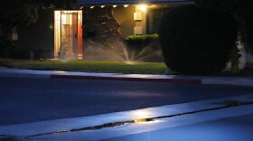 Sprinklers water a lawn at a home Thursday, June 8, 2023, in Las Vegas.