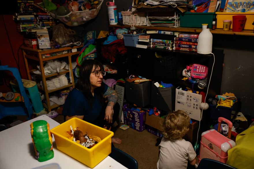Änna Farrar spends time with children May 30, 2026, in her home daycare in Warren County. Kids nap after the playtime and lunch, allowing Farrar some time to work on her own research.