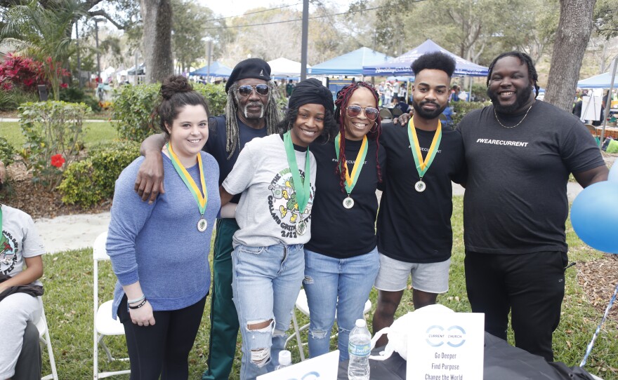 Members of the Current Church pose for a photo during the 2022 Publix Tampa Bay Collard Festival in St. Petersburg, Florida, on Saturday, February 19, 2022. Photo by Octavio Jones for WUSF