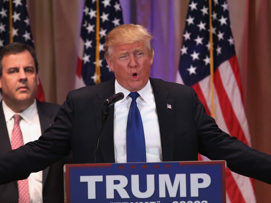 With New Jersey Gov. Chris Christie at his side, Republican presidential front-runner Donald Trump speaks to the media in Palm Beach, Fla., on Tuesday.