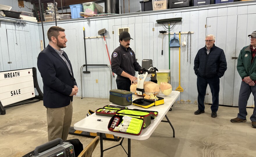 EMS Worker Mike Bever demonstrates an automatic CPR system. It allows for perfect compression, even in a moving ambulance, said Bever.