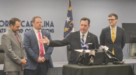 N.C. State Board of Elections executive director Sam Hayes, center, held a news conference Thursday about the start of mail-in absentee voting.