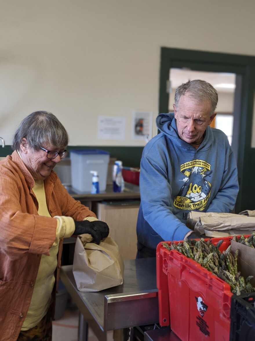 Feeding Laramie Valley volunteers put vegetables into the Shares bags that get delivered to those in the community that are unable to pick them up at the main building.