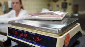 In this photo taken on Thursday, June 16, 2022, Dawna Stenzel weighs beef in the retail section of Wright's Meat Packing facility in Fombell, Pa. A survey says Floridians' biggest concern is inflation and the economy. (Keith Srakocic/AP)
