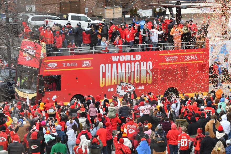  Kansas City Chiefs players drive down Grand Boulevard on a World Champions bus during the Super Bowl parade on Feb. 15, 2023.