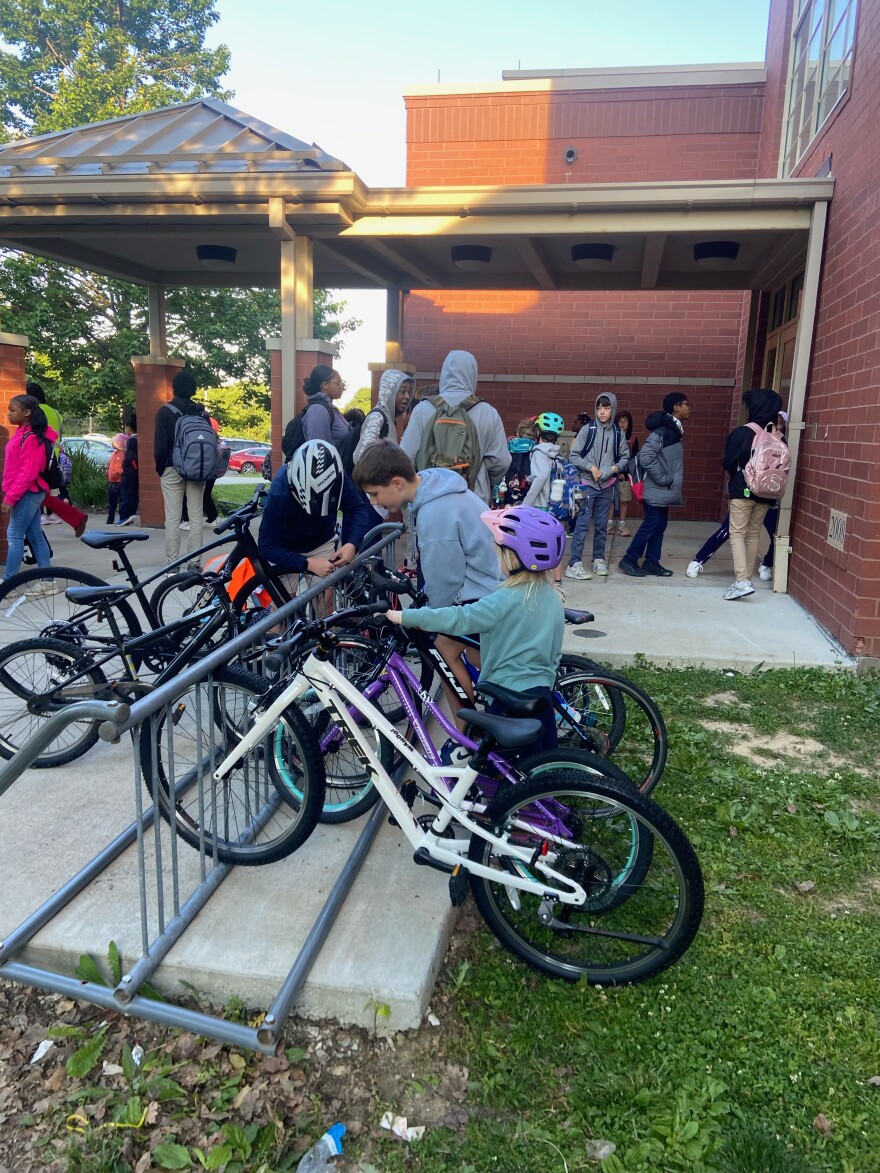 Students park their bikes after arriving to school via bike bus.