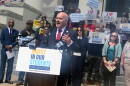 Andrew Spar, president of the Florida Education Association, announces the lawsuit on the steps of the historic Florida Capitol building.