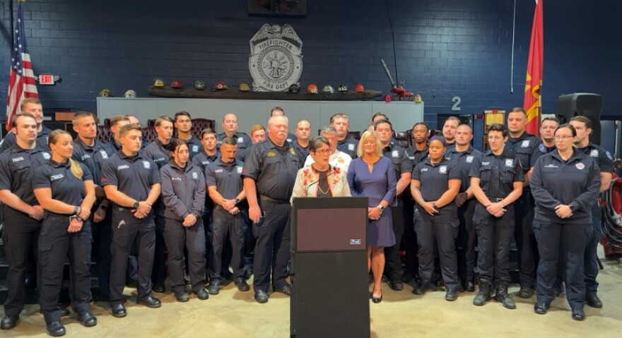 Lexington Mayor Linda Gorton and fire fighters who will receive emergency medical training