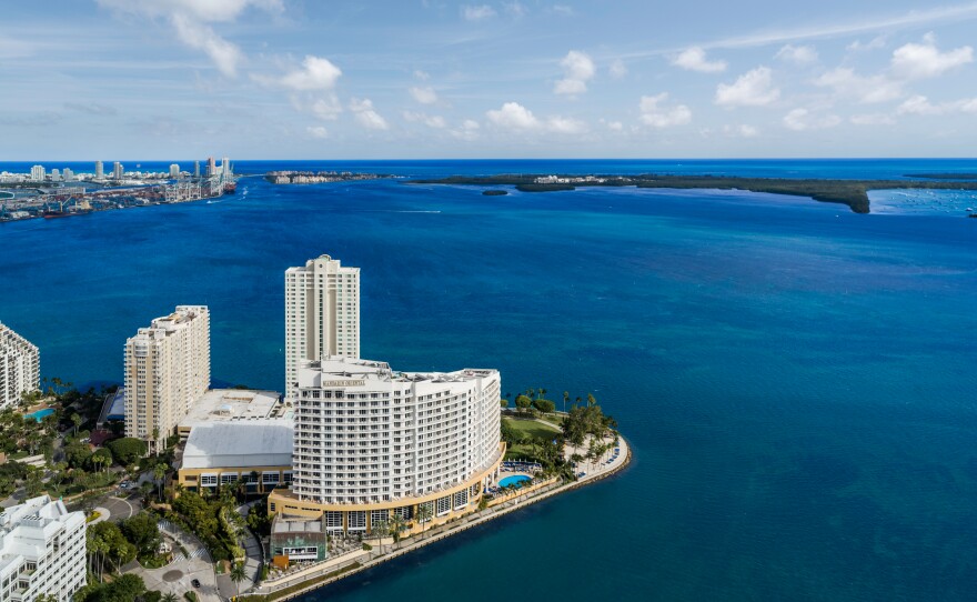 The former Mandarin Oriental Miami—a landmark that has anchored the southern tip of the private island for over 25 years—will be reduced to rubble in a matter of seconds on Sunday, April 12, 2026. The planned implosion will make way for The Residences at Mandarin Oriental, Miami, a two-tower ultra-luxury hotel and residential development scheduled for completion in 2030.