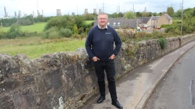 Kevin Ross, president of the Scottish Plastics and Rubber Association, in front of the INEOS Grangemouth refinery and chemical plant.