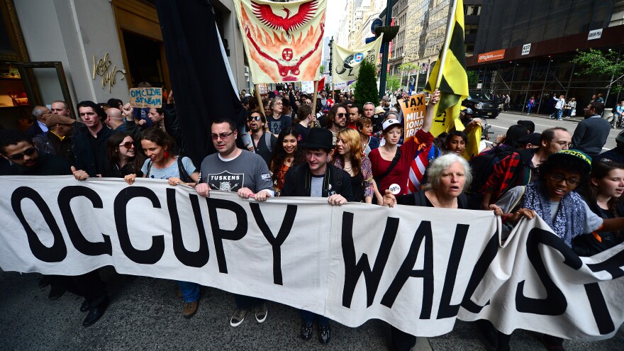 Occupy Wall Street participants march down Fifth Avenue as part of May Day events in New York, May 01, 2012. The Occupy movement that shook the United States last year, spawning similar protests worldwide, announced widespread May Day demonstrations and strikes against social inequality Tuesday. The protests, billed as stretching from New York to California, and from Spain to Australia, raised the possibility of disruption in dozens of urban centers on the date when many countries observe International Workers' Day. AFP PHOTO/Emmanuel Dunand (Photo credit should read EMMANUEL DUNAND/AFP/GettyImages)