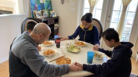 Cary residents Rong Cai and Yanshun Liu pray with their two sons February 22. It was the first Saturday the family had spent together since Cai returned from visiting her parents in Southern China and self-quarantined for 14 days upon arriving back in the U.S. 