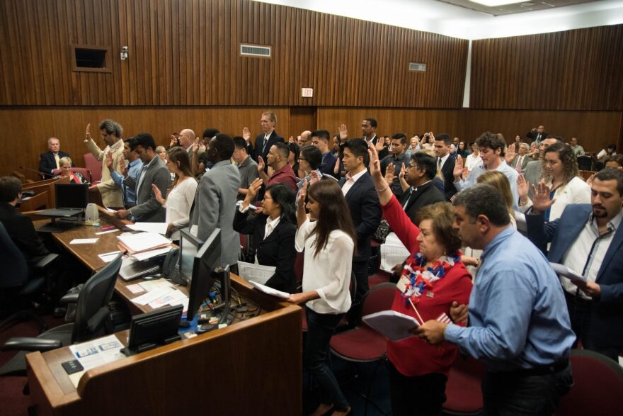 Thirty-Eight immigrants take the pledge to become American citizens.