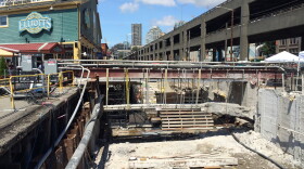 Crews have yet to finish stabilizing the soil behind the seawall. That work is going on in front of Colman Dock, nearby. But work has stopped in front of the shops and restaurants for tourist season. 