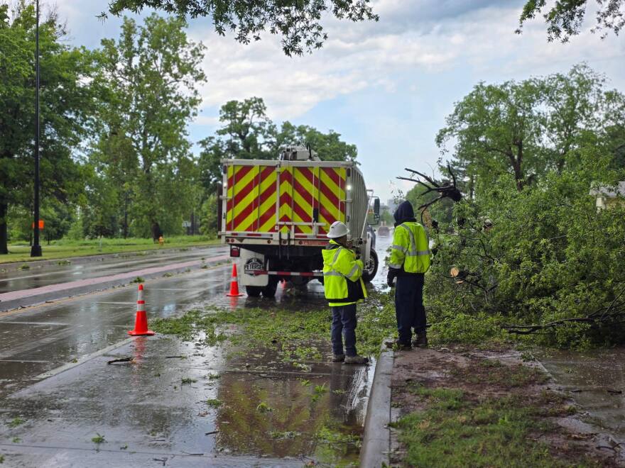 Tulsa city crews work to clear tree branches after severe weather in May 2025.