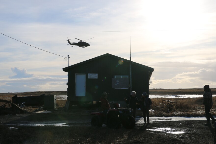 A National Guard helicopter hovers over Kwigillingok. Oct. 25, 2025.