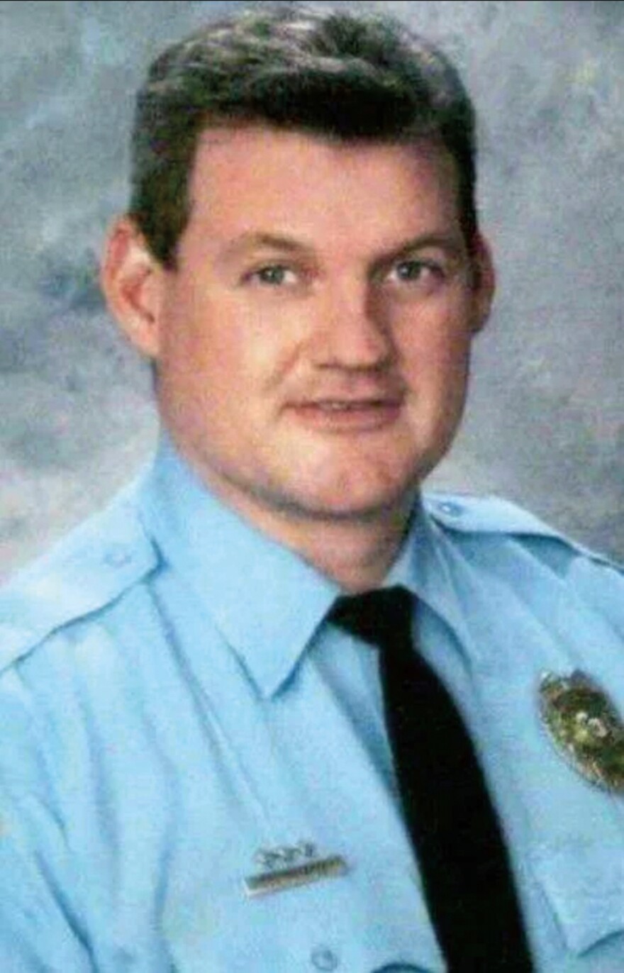 Kirkwood Sgt. William McEntee poses for a staff photo. He is white and wears a light blue police shirt with a dark tie. 