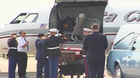 Lance Corporal Timothy G. Serwinowski's flagged draped casket was saluted