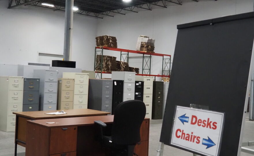 Surplus desks, chairs, filing cabinets and office supplies in storage at the Indiana Department of Administration warehouse.