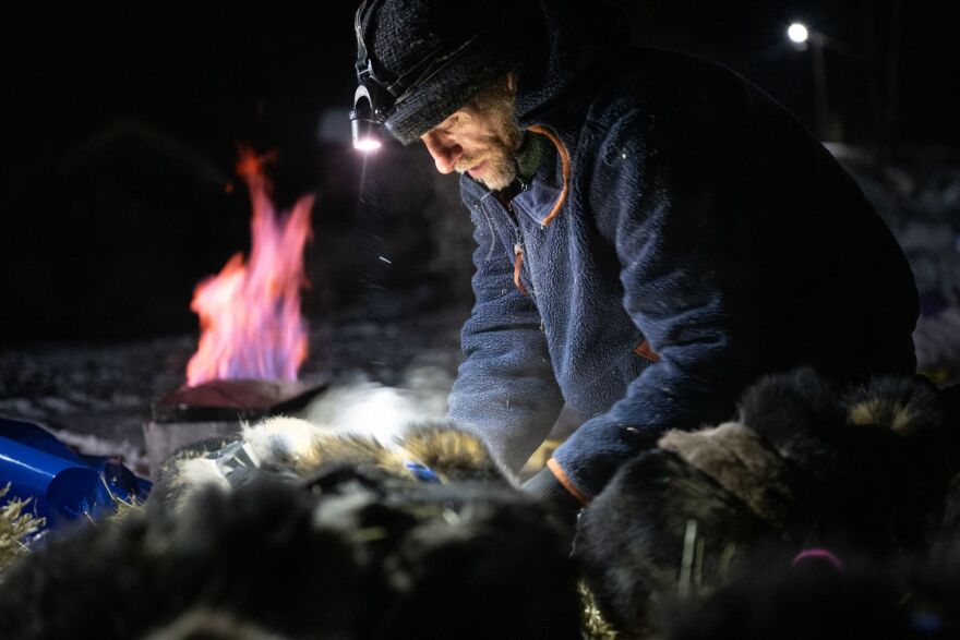 Jessie Holmes tends to his team after parking in Ruby. The frontrunners in the Iditarod Trail Sled Dog Race began to reach Ruby, a village on the Yukon River, on March 13.