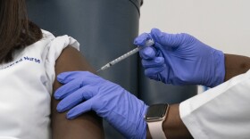 A nurse at Long Island Jewish Medical Center is inoculated with the COVID-19 vaccine on December 14, 2020 in the Queens borough of New York City. (Mark Lennihan/Pool/Getty Images)